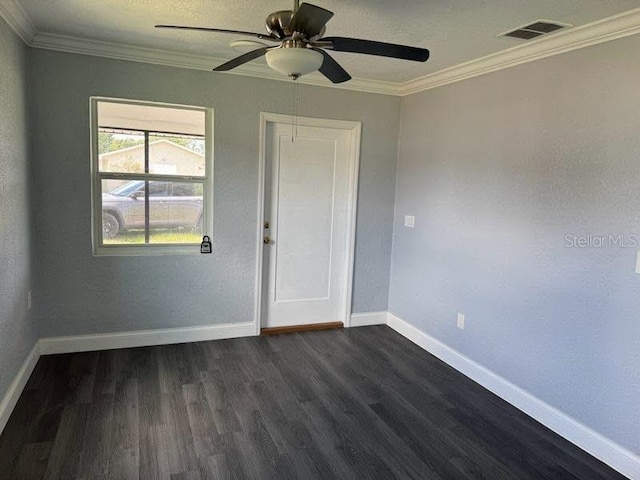 1426 Martin Luther King Jr Ave, Wauchula, FL 33873 - empty room featuring crown molding, dark wood finished floors, a ceiling fan, and baseboards