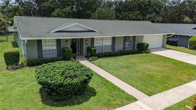 4514 Crichton Ln, Orlando, FL 32806 - single story home featuring roof with shingles, driveway, an attached garage, and a front lawn