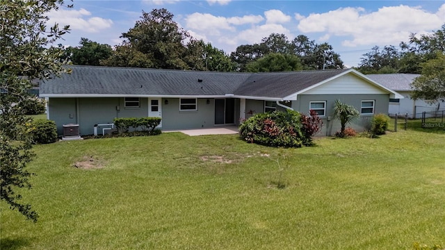 4514 Crichton Ln, Orlando, FL 32806 - rear view of property with a patio and central AC unit