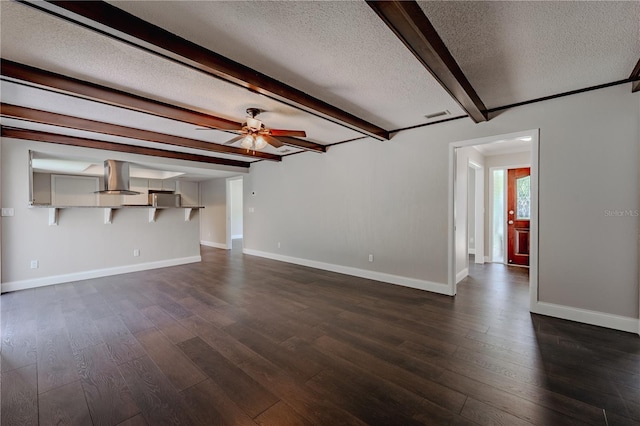 4514 Crichton Ln, Orlando, FL 32806 - unfurnished living room featuring a ceiling fan, a textured ceiling, beam ceiling, baseboards, and dark wood-style flooring