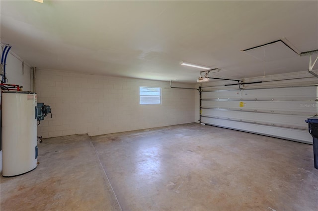 4514 Crichton Ln, Orlando, FL 32806 - garage with water heater, a garage door opener, and concrete block wall