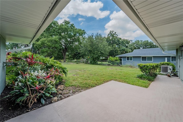 4514 Crichton Ln, Orlando, FL 32806 - view of yard with a patio area, central AC, and view of wooded area