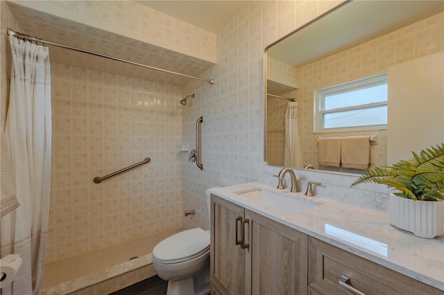 4514 Crichton Ln, Orlando, FL 32806 - bathroom with tile walls, tiled shower, toilet, and vanity