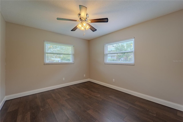 4514 Crichton Ln, Orlando, FL 32806 - unfurnished room featuring dark wood finished floors, healthy amount of natural light, and baseboards
