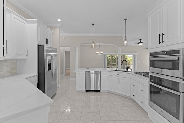 7214 SE 171st Brookhaven Pl, The Villages, FL 32162 - kitchen featuring appliances with stainless steel finishes, a sink, a peninsula, ceiling fan, and backsplash