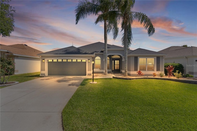 7214 SE 171st Brookhaven Pl, The Villages, FL 32162 - single story home featuring stucco siding, driveway, an attached garage, and a lawn
