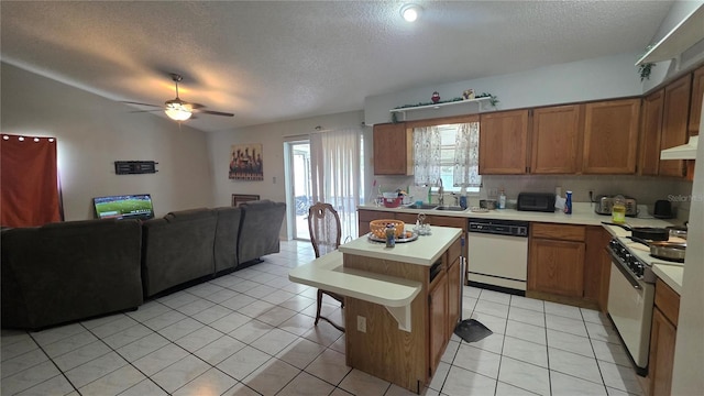 303 Silk Oak Dr, Kissimmee, FL 34743 - kitchen featuring white appliances, open floor plan, a textured ceiling, light countertops, and a ceiling fan
