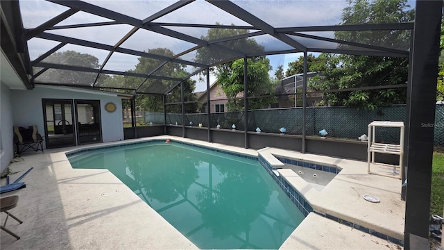 303 Silk Oak Dr, Kissimmee, FL 34743 - view of pool with a patio area, a pool with connected hot tub, and glass enclosure