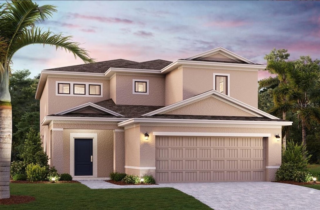 16842 Fiesta Dr, Port Charlotte, FL 33953 - view of front of house with a front yard, driveway, stucco siding, and an attached garage