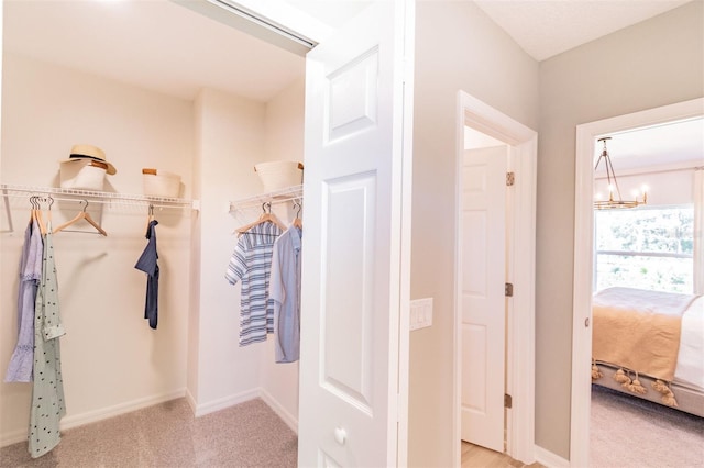 2046 Sunset Preserve Way, Port Charlotte, FL 33953 - spacious closet featuring carpet flooring and a chandelier