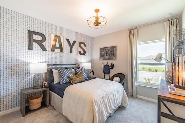2046 Sunset Preserve Way, Port Charlotte, FL 33953 - carpeted bedroom with wallpapered walls, an accent wall, baseboards, and a chandelier