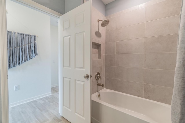 2046 Sunset Preserve Way, Port Charlotte, FL 33953 - bathroom with shower / tub combination, wood finished floors, and baseboards