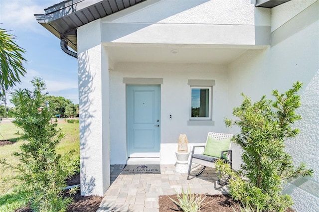 2046 Sunset Preserve Way, Port Charlotte, FL 33953 - doorway to property featuring stucco siding