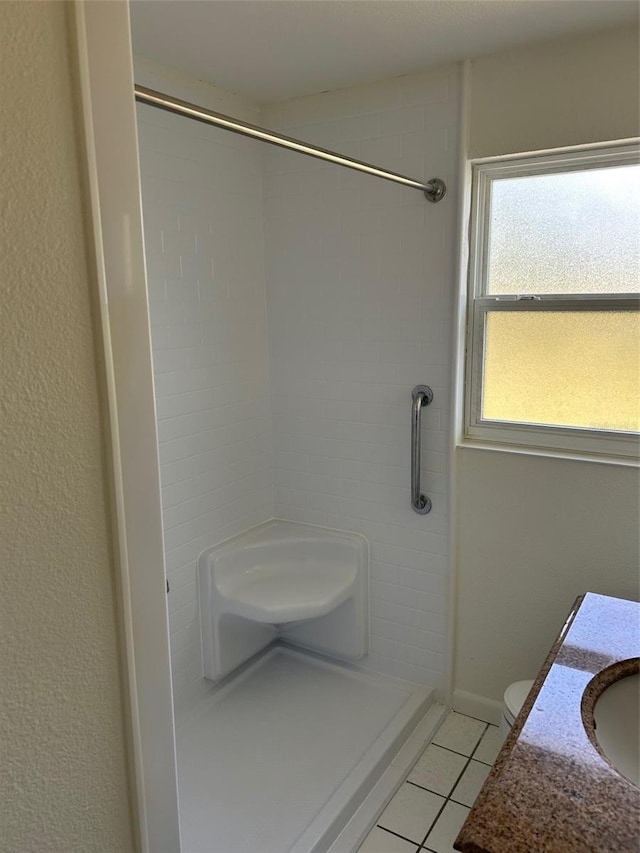 bathroom featuring tile patterned flooring and a shower