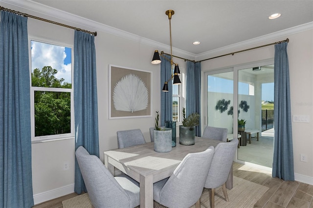 1688 Lugano Cir, North Venice, FL 34275 - dining area featuring crown molding, light wood finished floors, baseboards, and recessed lighting