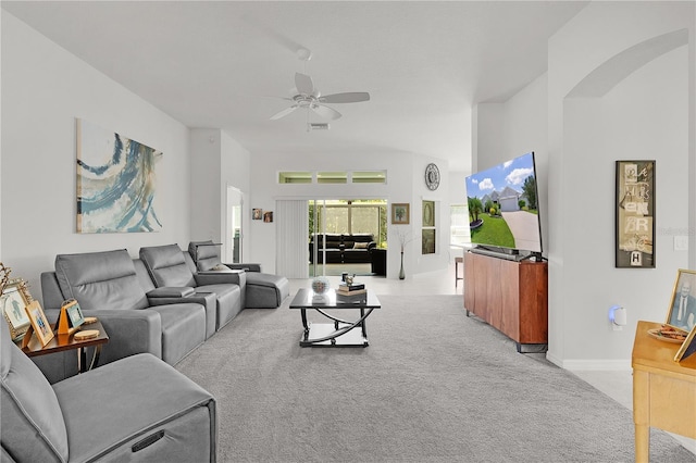 924 Figwood Loop, The Villages, FL 32163 - living room featuring light carpet, ceiling fan, and baseboards