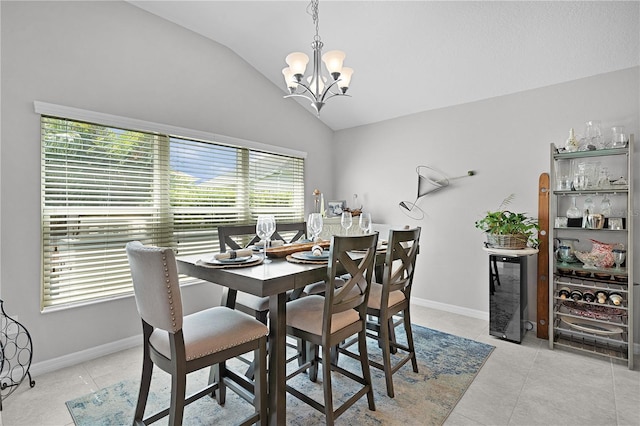924 Figwood Loop, The Villages, FL 32163 - dining room with vaulted ceiling, a chandelier, light tile patterned floors, and baseboards