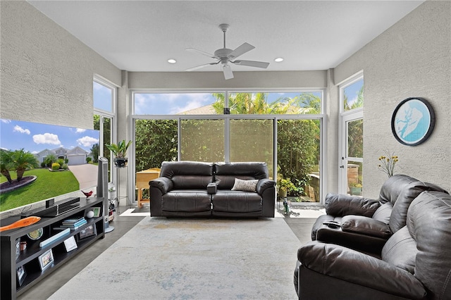 924 Figwood Loop, The Villages, FL 32163 - sunroom / solarium featuring a textured wall, finished concrete flooring, plenty of natural light, and recessed lighting