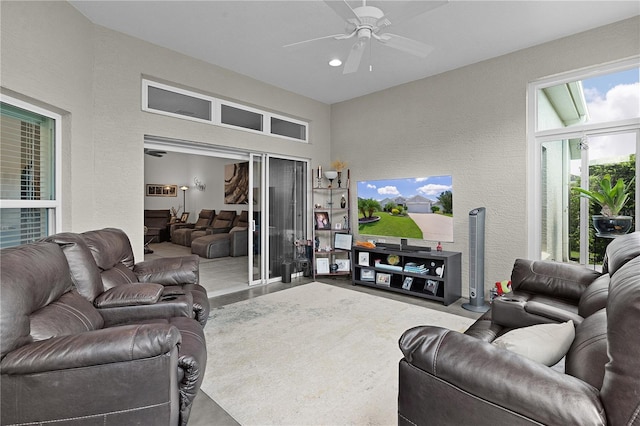 924 Figwood Loop, The Villages, FL 32163 - living area featuring ceiling fan, a textured wall, and recessed lighting