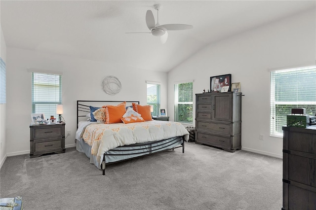 924 Figwood Loop, The Villages, FL 32163 - bedroom with vaulted ceiling, light carpet, multiple windows, and baseboards