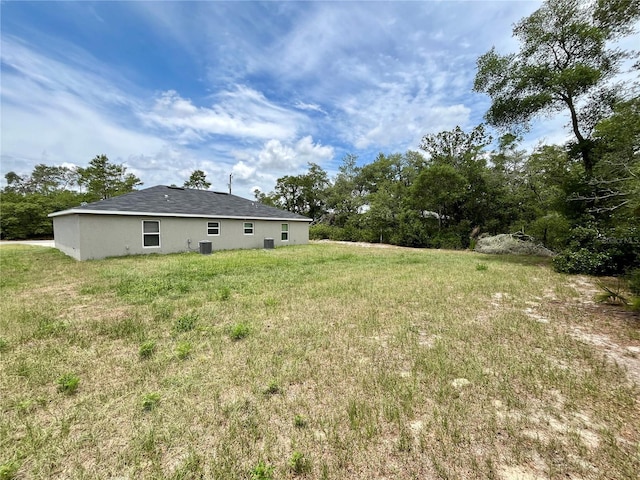 16221 SW 29th Court Rd, Ocala, FL 34473 - view of grassy yard featuring central air condition unit