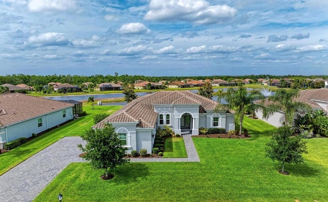 16617 5th Ave E, Bradenton, FL 34212 - view of front of home featuring a tile roof, a water view, and a front lawn