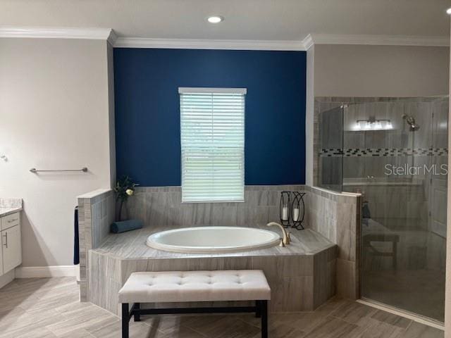 16617 5th Ave E, Bradenton, FL 34212 - full bath featuring a garden tub, vanity, a shower stall, crown molding, and recessed lighting