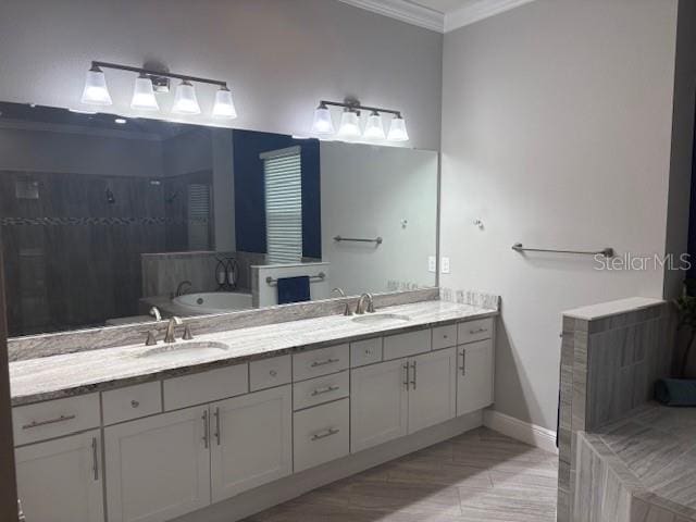 16617 5th Ave E, Bradenton, FL 34212 - full bathroom with ornamental molding, a garden tub, double vanity, and tiled shower