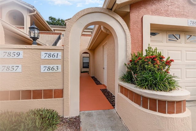 7863 Sugar Bend Dr Unit 7863, Orlando, FL 32819 - doorway to property with stucco siding