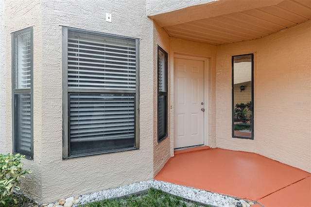 7863 Sugar Bend Dr Unit 7863, Orlando, FL 32819 - doorway to property with stucco siding
