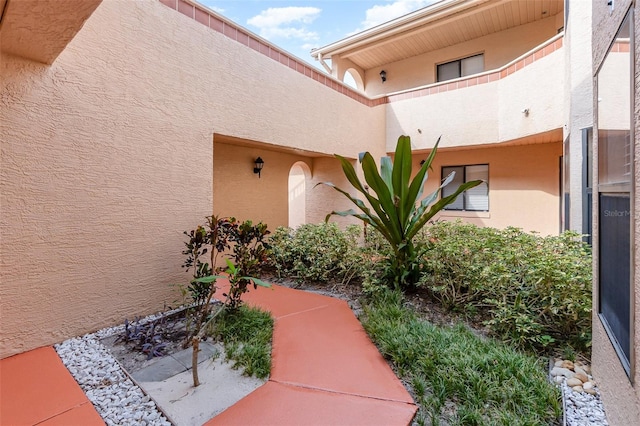 7863 Sugar Bend Dr Unit 7863, Orlando, FL 32819 - property entrance with stucco siding