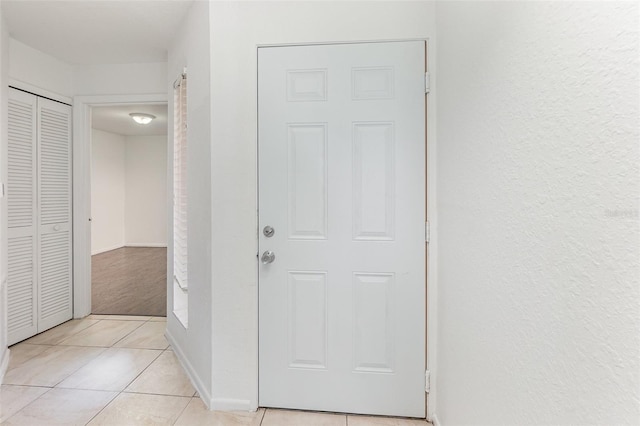 7863 Sugar Bend Dr Unit 7863, Orlando, FL 32819 - hall featuring light tile patterned flooring and baseboards