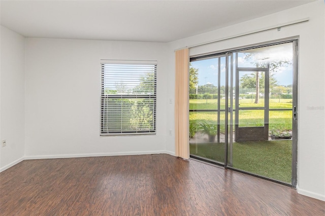 7863 Sugar Bend Dr Unit 7863, Orlando, FL 32819 - spare room featuring wood finished floors and baseboards