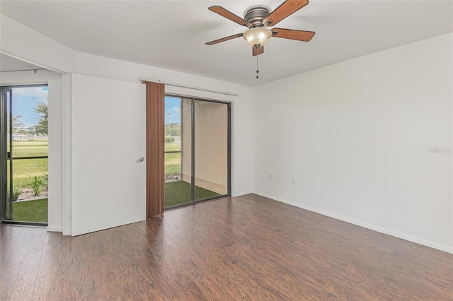 7863 Sugar Bend Dr Unit 7863, Orlando, FL 32819 - spare room with wood finished floors, a ceiling fan, and baseboards