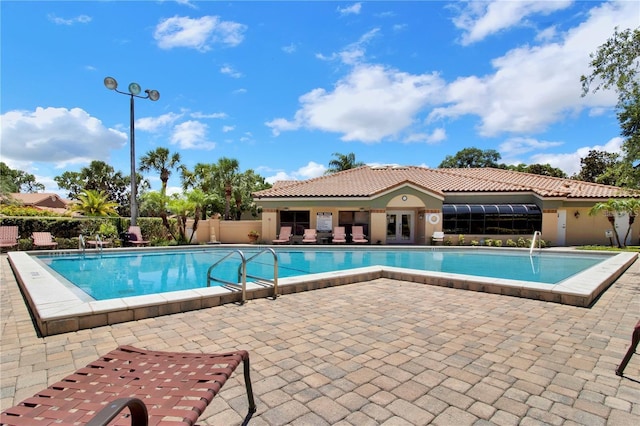 7863 Sugar Bend Dr Unit 7863, Orlando, FL 32819 - community pool with a patio area and french doors