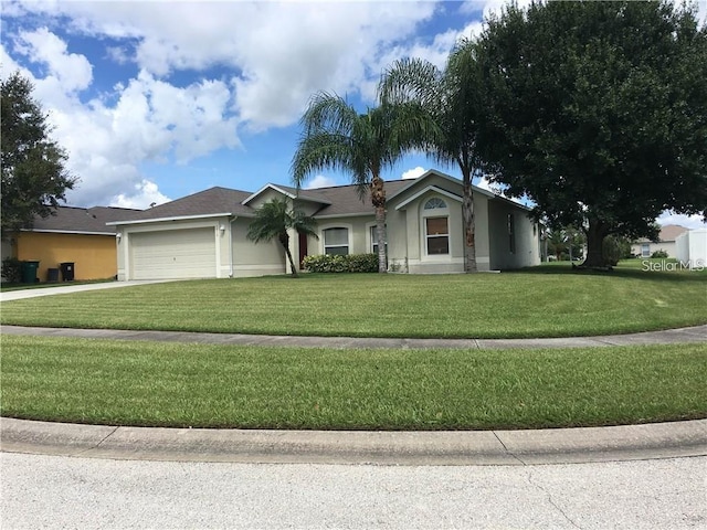 2470 Augusta Way, Kissimmee, FL 34746 - ranch-style house with stucco siding, a garage, concrete driveway, and a front yard