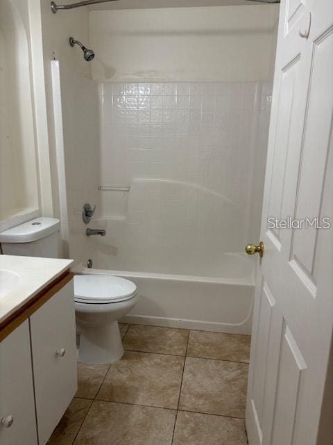 2470 Augusta Way, Kissimmee, FL 34746 - full bath featuring vanity, toilet, shower / washtub combination, and tile patterned floors