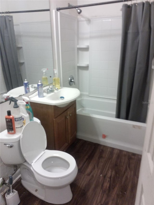 2822 S Dean Rd, Orlando, FL 32825 - bathroom featuring toilet, shower / bathtub combination with curtain, wood finished floors, and vanity