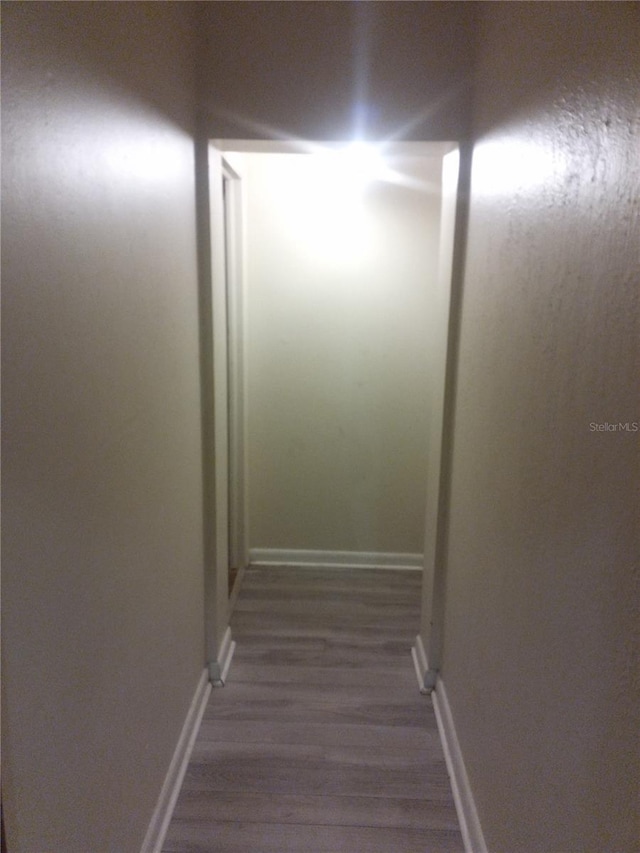 2822 S Dean Rd, Orlando, FL 32825 - hallway with dark wood finished floors and baseboards