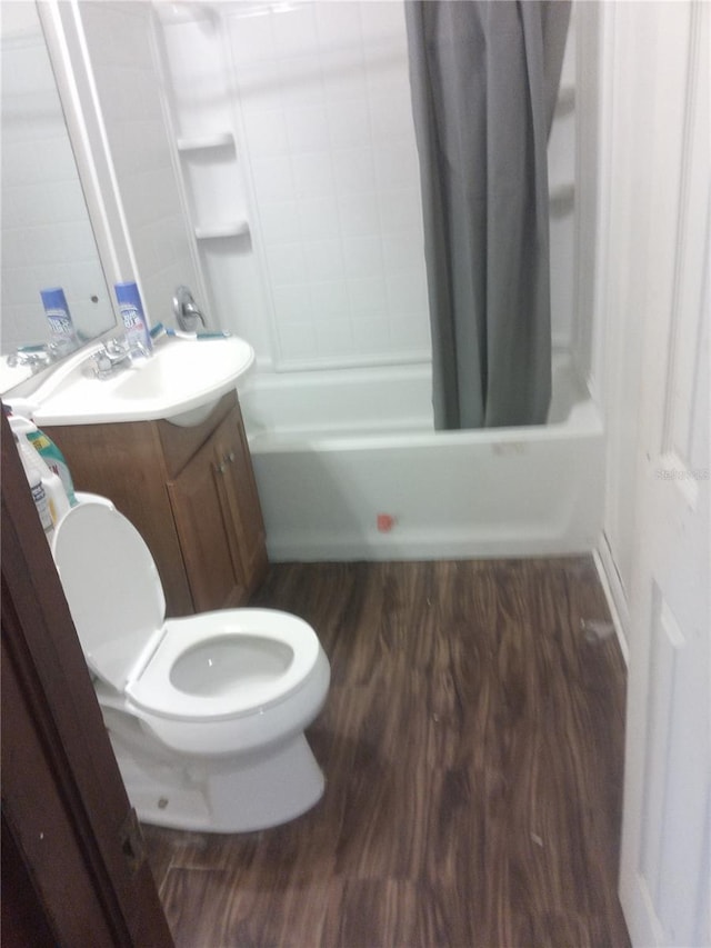 2822 S Dean Rd, Orlando, FL 32825 - bathroom featuring toilet, wood finished floors, shower / bath combo, and vanity