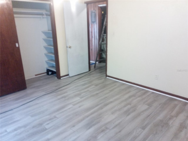 2822 S Dean Rd, Orlando, FL 32825 - unfurnished bedroom featuring wood finished floors and a closet