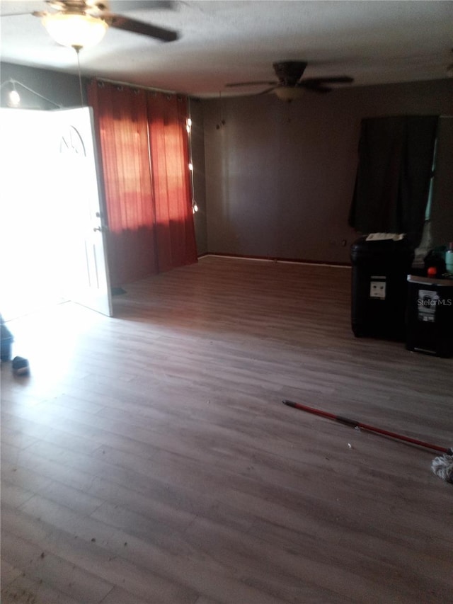 2822 S Dean Rd, Orlando, FL 32825 - unfurnished living room featuring a ceiling fan and wood finished floors