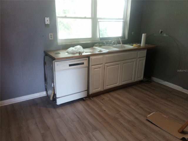 2822 S Dean Rd, Orlando, FL 32825 - kitchen featuring white dishwasher, wood finished floors, and healthy amount of natural light