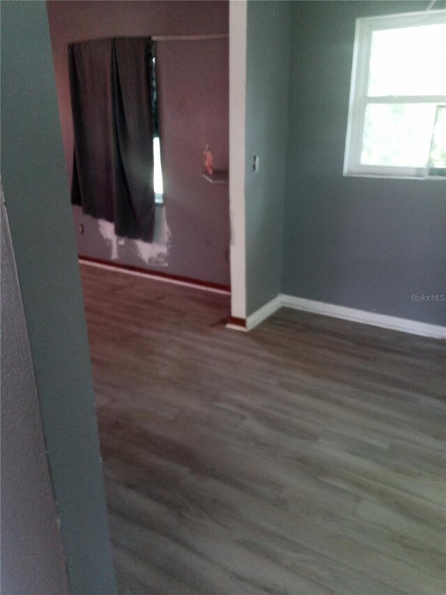 2822 S Dean Rd, Orlando, FL 32825 - unfurnished room with wood finished floors and baseboards