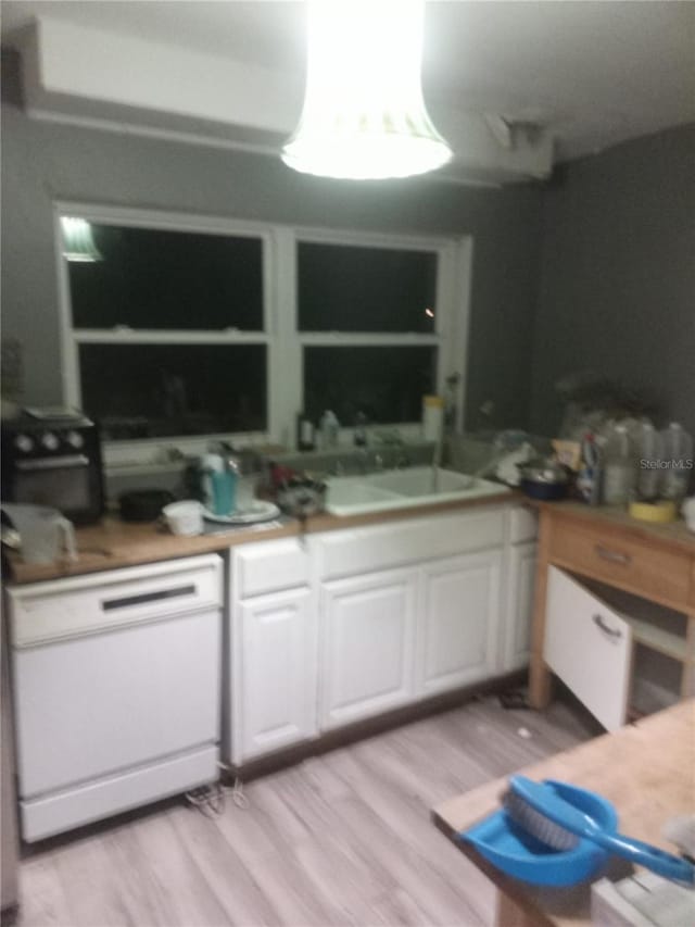 2822 S Dean Rd, Orlando, FL 32825 - kitchen featuring light wood-style floors, white cabinets, and dishwasher