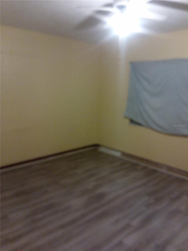 2822 S Dean Rd, Orlando, FL 32825 - unfurnished room with wood finished floors and baseboards