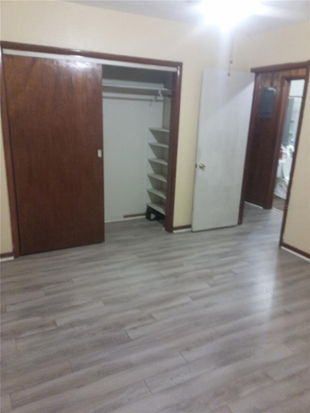 2822 S Dean Rd, Orlando, FL 32825 - unfurnished bedroom with light wood-style flooring and a closet