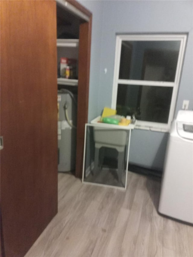 2822 S Dean Rd, Orlando, FL 32825 - washroom featuring wood finished floors and washer / dryer