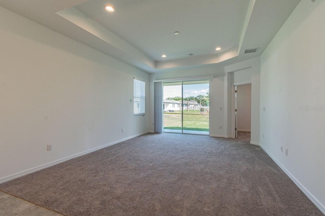 16866 Fiesta Dr, Port Charlotte, FL 33953 - carpeted empty room featuring a raised ceiling and recessed lighting