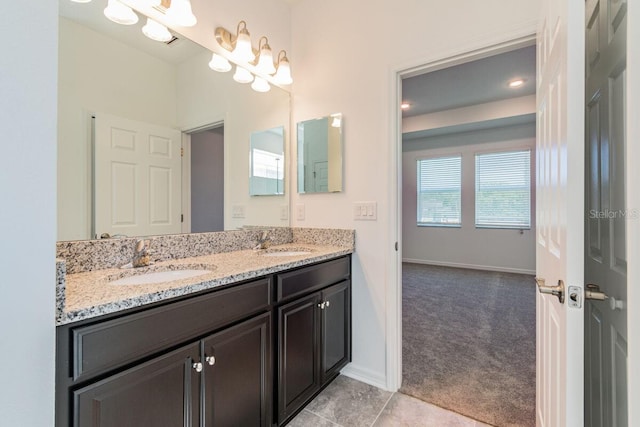 16866 Fiesta Dr, Port Charlotte, FL 33953 - bathroom featuring double vanity and tile patterned floors